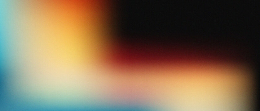 Abstract blurred background with a soft gradient of blue, orange, red, and black colors with a grainy texture