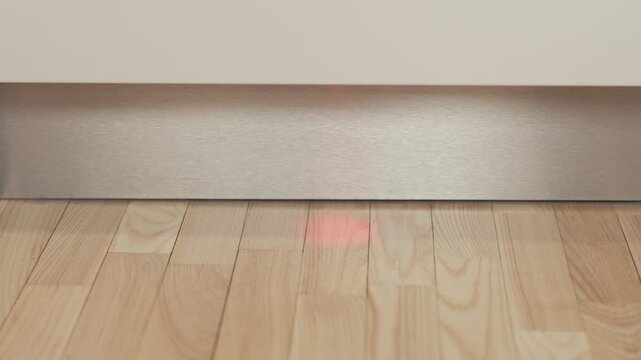 Dishwasher indicator: Detailed examination of laser spotting on wooden surface junctions