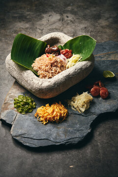 Traditional Thai Cuisine Fried Rice with Chili Paste Dipping Sauce Served with Boild Vegetables Egg Lime Chili Setup on Fresh Banana Leaf Stone Dish Platter Plate