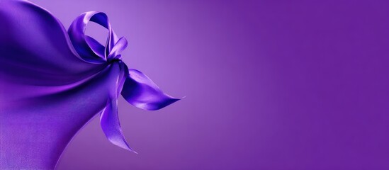 Curving purple fabric forms a knot on a light purple backdrop