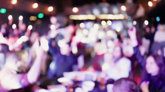 Night of music with animated spectators waving hands amidst dynamic colorful lighting and lively mood