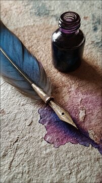 A vintage quill pen with a metal nib rests beside an open ink bottle, leaving a purple ink spill on textured paper.