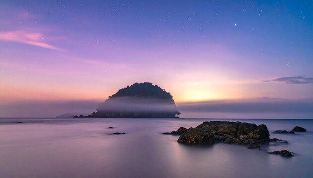 Serene ocean landscape at twilight with a misty island and purple pink sky filled with stars and soft clouds
