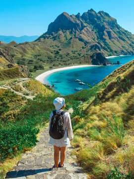 Traveler with amazing view of Landscape at Padar island in Komodo National Park, Indonesia