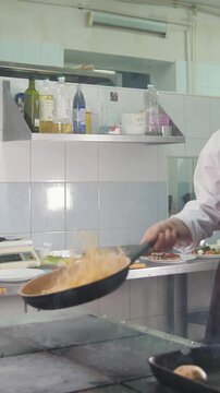 Process of cooking spaghetti - cheif in restaurant