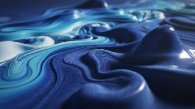 Abstract flowing blue and cyan liquid paint texture with glossy reflective surface and swirling shapes