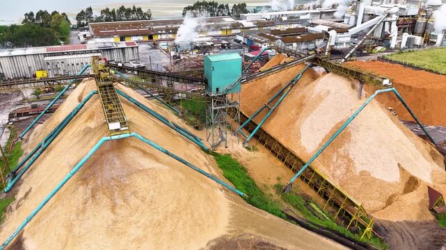 Aerial view of a wood chip pile at a pulp and paper mill