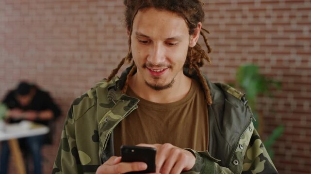 Phone, scroll and happy man in college for online, internet or communication with about us information. Typing, search and student person for learning results, update or check schedule on campus app