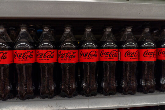 Villa de Alvarez, Colima. Mexico. April 14, 2026: Shelf Display of Multiple Coca Cola Zero Sugar Bottles Labeled with Red Band