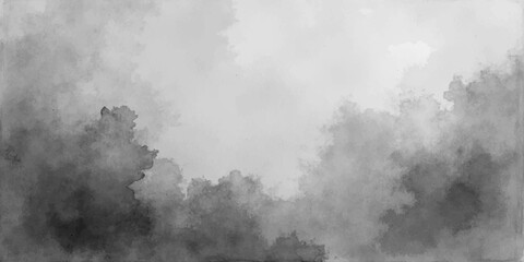 A misty morning landscape of dark mountain peaks under a cloudy blue sky where thick white fog and smoke-like mist drift through a quiet forest light © RASEL