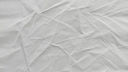 Fototapeta premium White creased recycled paper with soft abstract crumpled texture. Blank wrinkled sheet background with subtle old paper surface.