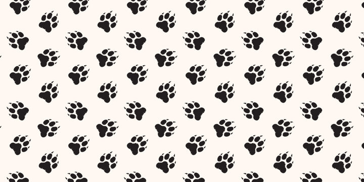 Seamless pattern with black animal paw prints on a light beige background