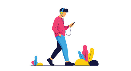 Fototapeta premium Young man walking while listening to music through headphones and looking at his smartphone on a clean white background.