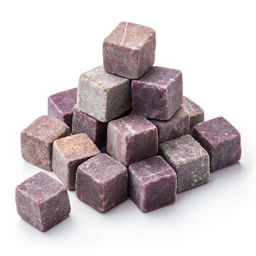 Pyramid stack of purple stone whiskey cooling cubes on a white background