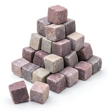 Pyramid of purple and grey stone whiskey cubes on a white background