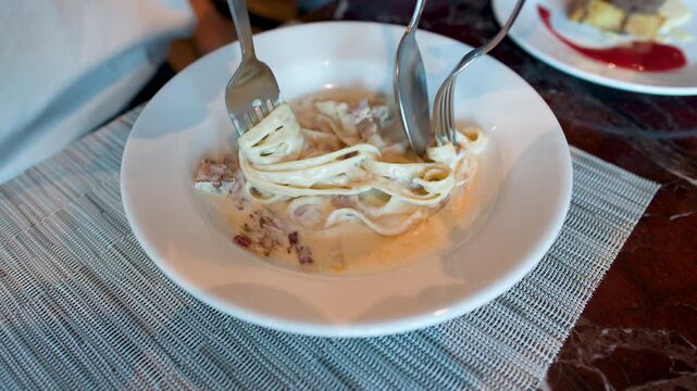 Creamy Fettuccine Carbonara Pasta with Bacon Served in a White Bowl