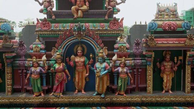 Vibrant temple sculptures representing Hindu mythology at Batu Caves landmark.
