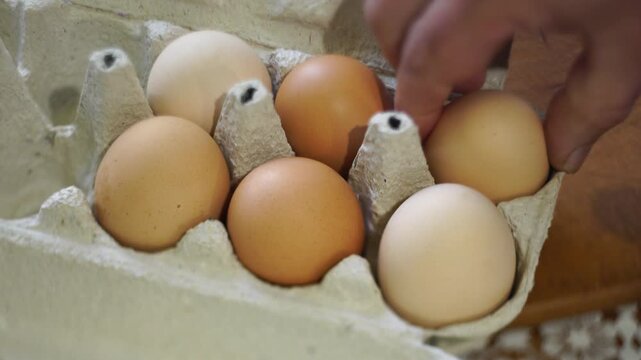 takes a few eggs from the package