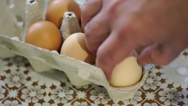 takes a few eggs from the package