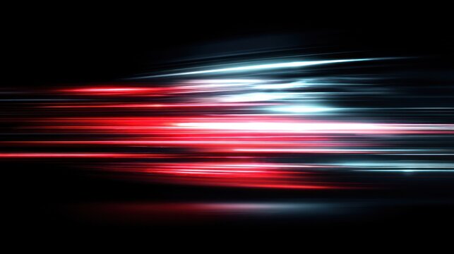 Abstract red and blue light trails on black