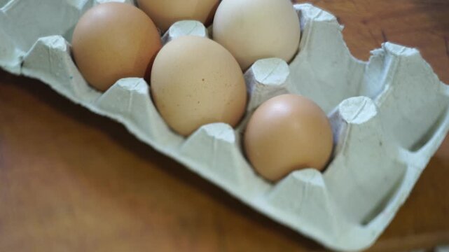 takes a few eggs from the package