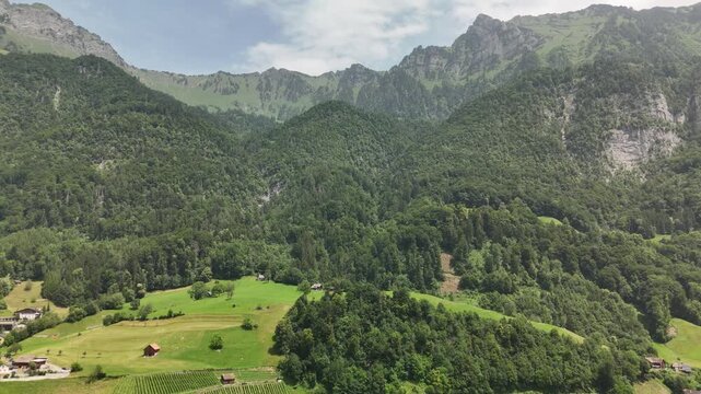 Scenic aerial view of rural countryside and Alpine mountain landscape near Flums, Berschis and Walenstadt on Lake Walensee, in the canton of St. Gallen, Switzerland