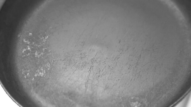 Place the frying pan on a hot electric stove