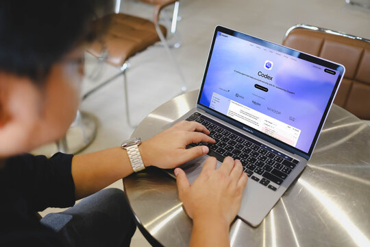 Bangkok, Thailand. May 13, 2026; A person types on a laptop displaying the Codex AI assistant interface powered by ChatGPT while working in a modern office environment.