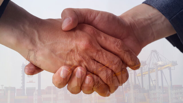 The business success achievement with a handshake and deal agreement between two business partners International Trade Agreement Successful Shipping Cooperation