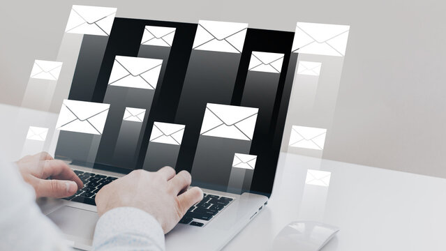 Many emails appear on a laptop screen during a busy work session on a weekday morning
