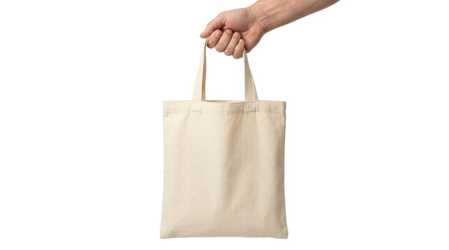 Beige canvas tote bag in hand isolated. Eco friendly shopping bag mockup.