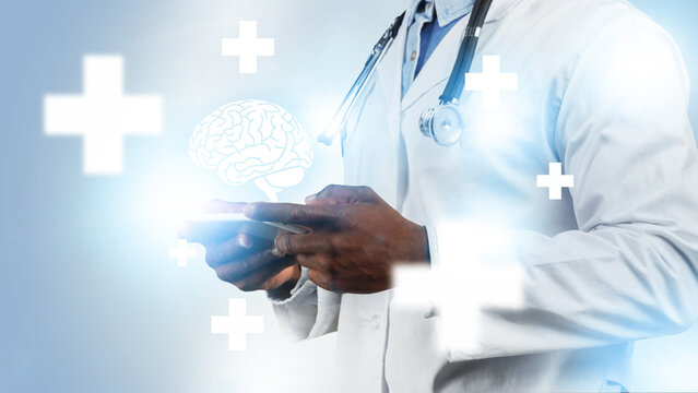 Doctor using tablet with brain graphics in health technology setting
