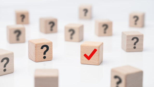 Correct choice and decision making concept with wooden cubes