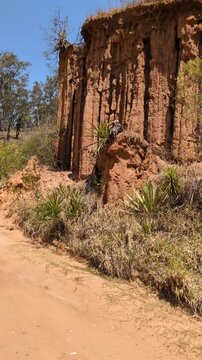 Woman Hiker on Dusty Dirt Road near Samaipata, Bolivia. Female Traveler Exploring Rural Trails in Santa Cruz Highlands, Adventure and Active Lifestyle in South America.
