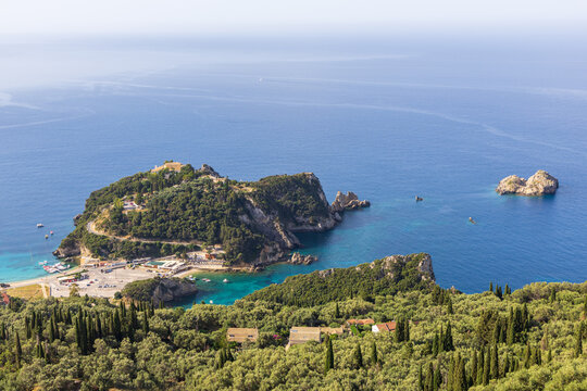 Aerial view on village Paleokastritsa of greek Corfu island in sunny summer day. Tourism in Europe.