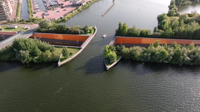 Veluwemeer Aqueduct, road crosses under a waterway in the Netherlands. Innovative intersection of highway and Water Bridge.