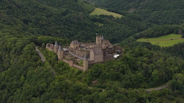 Aerial view flying around bourscheid castle in luxembourg