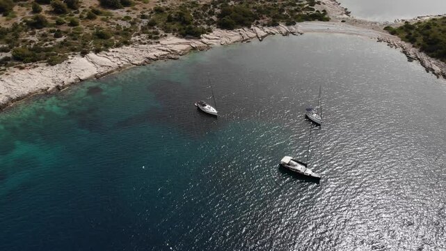 Zirje island in Croatia. Paradise cove with sailing yachts. Drone view of Croatia.