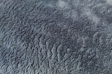 Soft and comfortable dark grey fleece fabric texture © Hendri