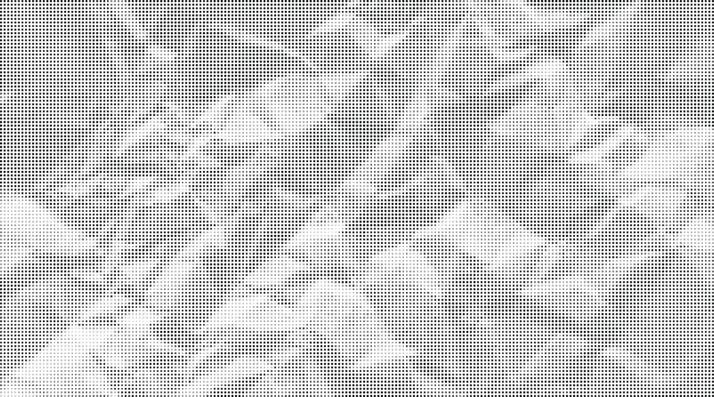 The crumpled sheet of white paper lies on a surface with many folds and creases.