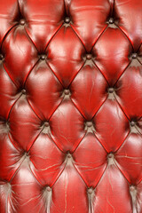 Naklejka premium Detailed texture of vintage red leather tufted furniture upholstery background