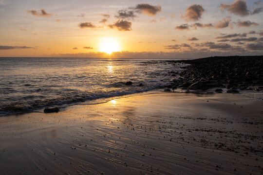 Amazing colorful sunset over the Ponta Preta beach (Black tip beach) on the southern part of the beautiful island of Sal in Cape Verde. The popular beach is isolated and deserted but gives amazing vie