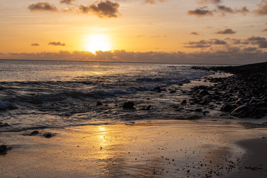 Amazing colorful sunset over the Ponta Preta beach (Black tip beach) on the southern part of the beautiful island of Sal in Cape Verde. The popular beach is isolated and deserted but gives amazing vie