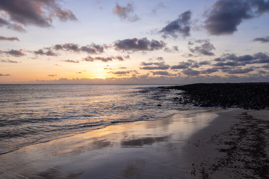 Amazing colorful sunset over the Ponta Preta beach (Black tip beach) on the southern part of the beautiful island of Sal in Cape Verde. The popular beach is isolated and deserted but gives amazing vie
