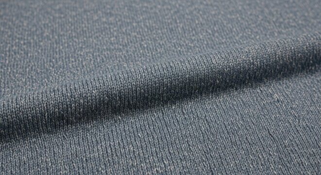 close-up of textured paper fabric with intricate knit pattern and soft folds