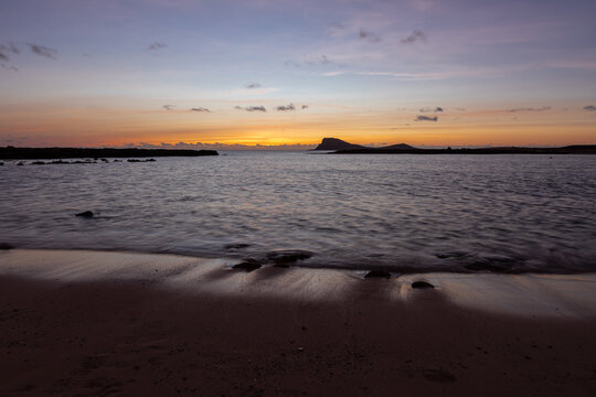 A beautiful sunset full of colors on Murdeira Beach, which is a quiet, scenic sandy and rocky cove located on the sheltered west coast of Sal Island, Cape Verde. The beach is located inside a protecte