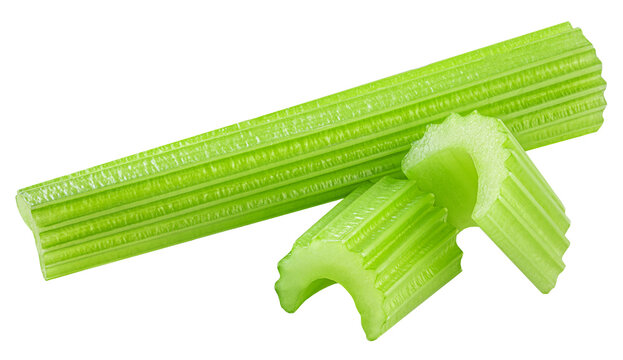 Celery ribs isolated on white. Fresh Celery stems with chopped celery pieces  closeup. Dieting food  vegetables
