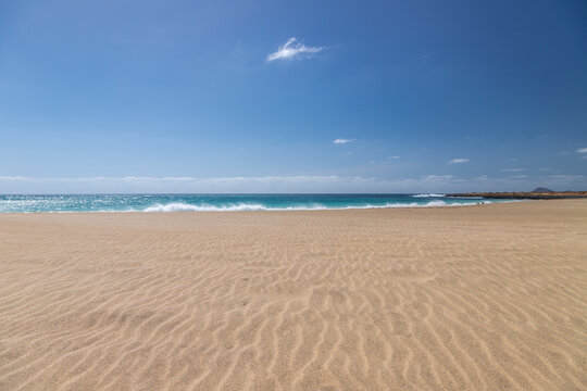The beautiful beach of Ponta Preta (English translation: Black Beack) is a tranquil part of Sal Island in Cape Verde without many tourists but with a perfect golden sand beach and turqiouse water crea