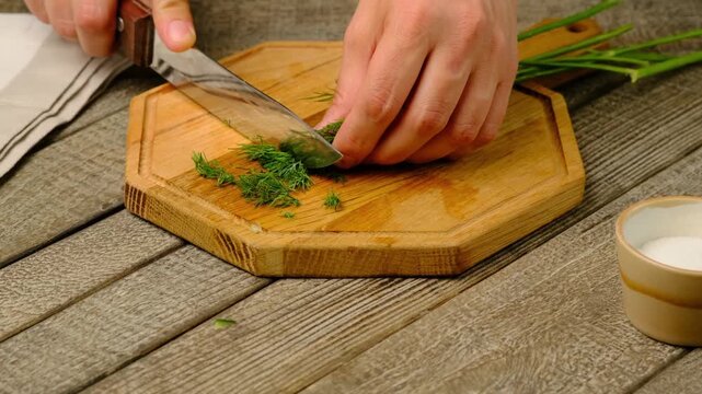 Step-by-step preparation of Bulgarian cold tarator soup with fresh cucumber, dill, natural yogurt or sour milk on a gray wooden background. Bulgarian cuisine. Step-by-step video recipes.