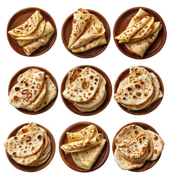 Set of Yemeni malawah flaky buttery bread baked round flatbreads with toasted spots stacked in pile, isolated on white background